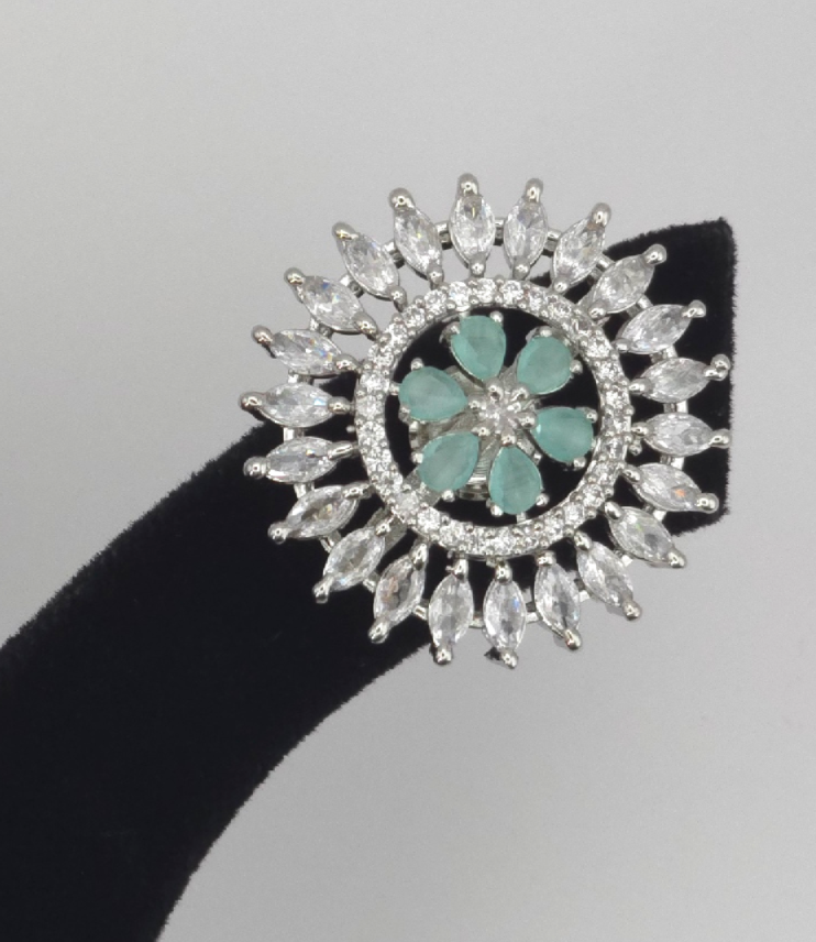 Sparkling Floral Stud Earrings with Green Gemstone Center