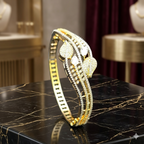 Celestial Duo-Tone Leaf & Starburst Bracelet | سوار أوراق الشجر السماوي بلونين الذهبي والفضي