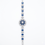 Blue Floral Silver-Tone Bracelet | سوار فضي بتصميم زهري وأحجار زرقاء